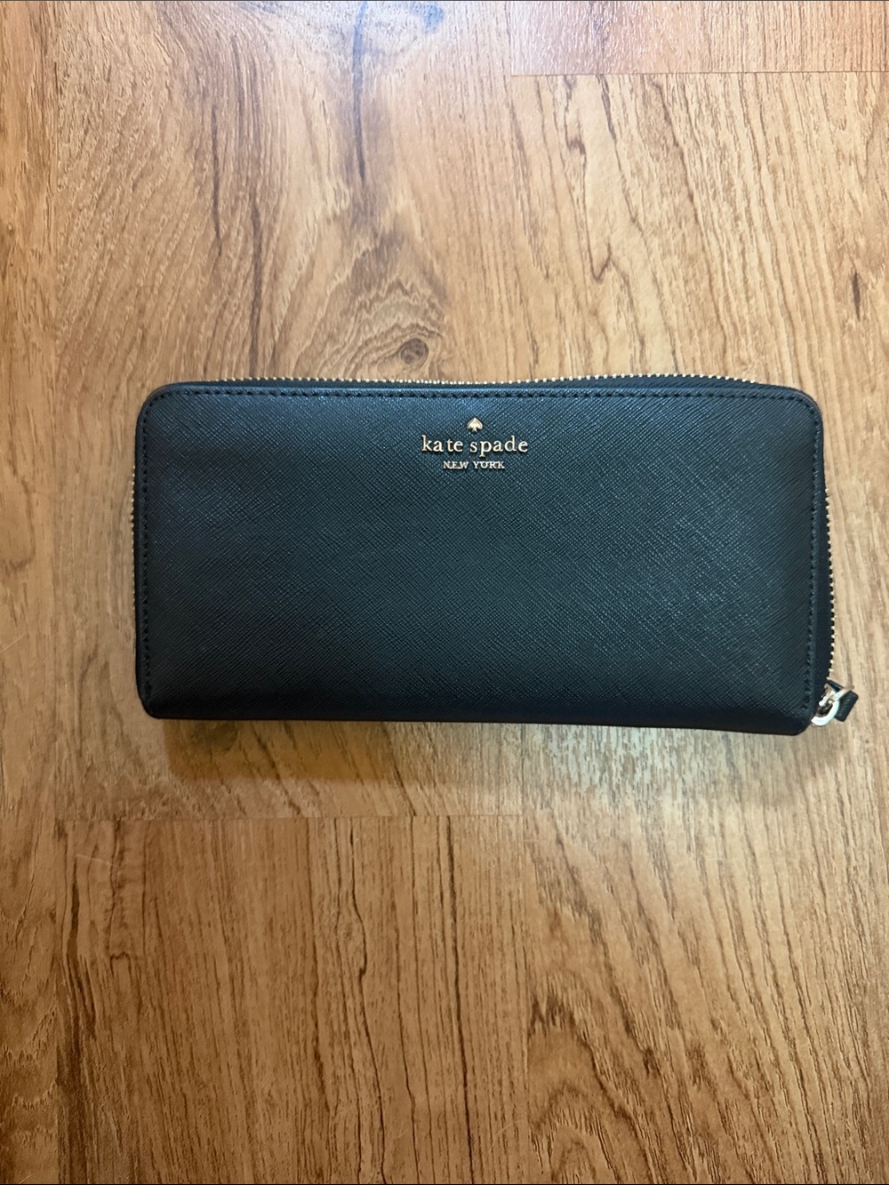 kate spade black zip-around saffiano wallet with gold logo